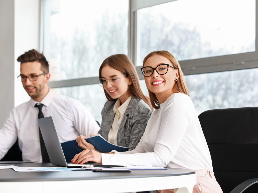 Colleagues discussing issue at business meeting in office
